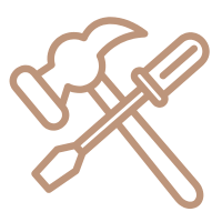 A person uses a hammer and chisel on stone, focusing intently. The tools are crossed, symbolizing craftsmanship and precision in their work.